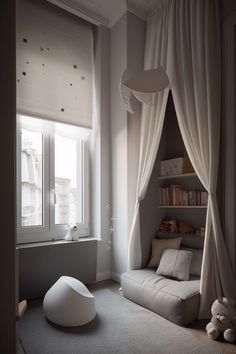 a room with a couch, book shelf and window in it that has curtains on the windowsill