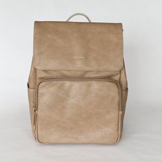 Our Diaper Bag is 100% Faux Vegan Leather with hand-crafted stitching and zippers. It's stylish design and durability makes it your go-to for every occasion. It's multi-purpose, serving as a diaper bag, purse, handbag, backpack, tote bag, laptop bag, carry on luggage, and much more. You will not sacrifice style or functionality with this all in one bag! Stroller Hooks, Timeless Shoes, Backpack Tote, Stroller Straps, Backpack Tote Bag, Carry On Luggage, One Bag, Shoe Style, Handbag Backpack