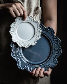 a person holding a plate in their hands