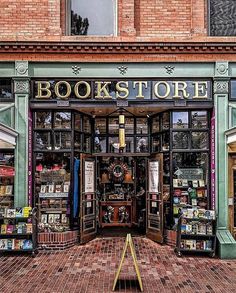 the front entrance to a book store with lots of books on display