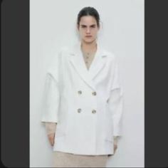 Lapel Collar Coat With V Front And Long Sleeves. Front Patch Pockets. Double Breasted Button Closure Casual White Outerwear With Double Button Closure, Oversized Blazer With Buttons For Office, White Casual Outerwear For Office, Casual White Outerwear For Office, Oversized Office Blazer, White Collared Blazer With Buttons, White Spring Outerwear With Double Button Closure, Fall White Blazer With Button Cuffs, Spring White Outerwear With Double Button Closure