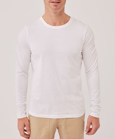 Men's White Softspun Long Sleeve Tee L. Super soft organic men's Softspun Long Sleeve Tee from Wear PACT. Fair Trade Factory. GOTS Certified Organic Cotton Fitted Cotton Long Sleeve Top, Basic Cotton Long Sleeve Top For Spring, Basic White Cotton Long Sleeve Top, Basic Cotton Long Sleeve Top For Loungewear, Basic Cotton Tops For Layering, Long Sleeve T-shirt For Casual Spring Gatherings, Long Sleeve T-shirt For Casual Gatherings In Spring, White Long Sleeve Tops For Casual Gatherings, White Crew Neck Top For Casual Gatherings