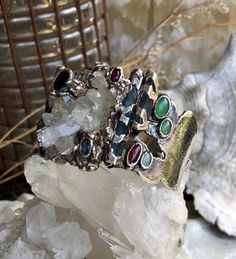 Amazing One of a Kind Artisan Multi Gemstone 999 Sterling Silver Druzy Rock Crystal Vintage Bracelet Wearable Art Stunning Gemstones of Druzy Quartz Rock Crystal , Opal , Garnet , Saphire , chrysoprase, pink turmaline weighs 87 grams of Gemstones and silver face is over 1 inch tall Collectible Gemstone Bangle Bracelets, Collectible Silver Bracelets With Natural Stones, Silver Gemstone Bracelet With Stones, Silver Fusion Bracelets With Stone Setting, Fusion Multi-stone Bangle Jewelry, Fusion Style Multi-stone Bangle Jewelry, Fusion Style Bracelets With Stones As Gifts, Fusion Style Bracelets With Stones For Gifts, Unique Multi-stone Bangle Bracelet