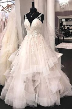 a wedding dress on display in a store