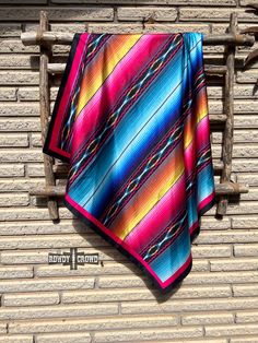 Introducing the Serape Aztec Wild Rag - the perfect way to add a bold pop of color to any outfit! With its eye-catching aztec print, this versatile accessory can be worn in multiple ways, showing off your unique and rowdy style. Make a statement and turn heads wherever you go! Appx. 36" x 36" 100% Polyester Wild Rag, Aztec Print, New Caledonia, Solomon Islands, Turks And Caicos, Caicos Islands, Turks And Caicos Islands, Papua New Guinea, Maldives