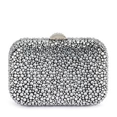 With its curved lines and glossy hardware, the Casey Hot Fix Encrusted Clutch is a total show stopper. The rounded square shape fits comfortably in the palm of your hand. Wear it as a shoulder bag or wear it as a clutch by tucking the shoulder chain inside. W18cm x H12cm x D6cm Shoulder chain drop length 50cm Encrusted block lock closure Removable shoulder chain Fits a smart phone Silver Rectangular Clutch For Cocktail, Silver Rectangular Evening Bag For Cocktail, Rectangular Silver Evening Bag For Cocktail, Glamorous Rectangular Cocktail Evening Bag, Silver Evening Bag With Rhinestones For Cocktail, Rectangular Silver Bag For Cocktail, Chic Sparkling Rectangular Clutch, Silver Embellished Clutch For Night Out, Silver Rhinestone Evening Bag For Cocktail