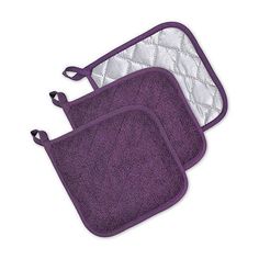 three purple and white kitchen mats with handles