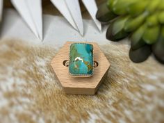 If you're looking for a stunning stone, then look no further. This handcrafted Mohave Turquoise ring was crafted with love by me from start to finish. Ready to ship, approximate size 7 1/4 ring in sterling and fine silver, this is sure to be one of your faves. It's perfect for everyday wear or dressing up and will blend with any style. The minimalist style, with a chunky stone still makes a beautiful statement. Heirloom quality and made to last. Snag it while it's available - once this one-of-a- Adjustable Southwestern Turquoise Ring With Natural Stones, Handmade Turquoise Ring For Healing, Adjustable Untreated Turquoise Ring, Adjustable Chrysocolla Turquoise Ring, Adjustable Turquoise Healing Ring, Boho Cowgirl, Cowgirl Chic, Southwestern Style, Green Turquoise