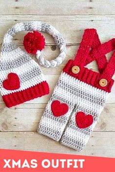 two knitted mittens, one with red hearts and the other white