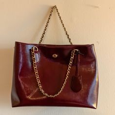 Used 3 Times. Looks Brand New. Burgundy/Maroon Color With Gold Hardware And Chain. Classic Bag With Chain Strap And Double Handle, Formal Burgundy Bags With Metal Hardware, Coach Burgundy Shoulder Bag With Gold-tone Hardware, Everyday Burgundy Bag With Gold-tone Hardware, Everyday Use Burgundy Shoulder Bag With Metal Hardware, Classic Everyday Satchel With Chain Strap, Classic Satchel With Chain Strap For Everyday, Burgundy Shoulder Bag With Metal Hardware For Everyday Use, Elegant Brown Bag With Chain Strap