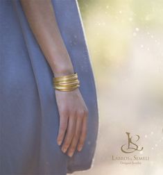 "It has been quite a long time since we uploaded one of our cuffs despite the fact that it is one of our favorite type of jewelry. We are very happy to present to you our Isitha Cuff. A solid silver and gold plated piece reminiscent of the splendor of ancient craftsmanship, free and eloquent in form, stunning to look at. Something worthy of a goddess. All of our jewelry are handcrafted by us. As we say, we became sculptors first and jewelers second. We find something beautifully romantic in taki Elegant Ceremonial Cuff Bracelet, Fusion Style Wedding Cuff Bracelet, Elegant Ceremonial Cuff Bangle, Elegant Cuff Jewelry For Weddings, Gold Cuff Jewelry For Weddings, Elegant Cuff Wedding Jewelry, Elegant Yellow Gold Cuff Bracelet For Wedding, Ancient Greek Wedding, Wedding Cuff Bracelet