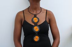 African Pendant necklace, Beaded Fringe Necklace, Beaded Multi-strand necklace, Statement Necklace, Christmas gift for her, Moms gift An elegant necklace that can match any outfit. Handmade by the Maasai women in Kenya using fine beads. Color: Orange Available in different colors. Kindly select your color Dimensions:  Necklace length: 22 inches/ 55 cm Neck size: 15 inches / 38 cm 3-5 days delivery via DHL Express.  Pay shipping fee for the first item only and additional items ship for free. To view more items in our shop, kindly click here:  nkoroicrafts.etsy.com Wooden Beads Choker Necklace As Gift, Wooden Beads Choker Beaded Necklaces For Gifts, Orange Beaded Necklaces With Wooden Beads For Gifts, Orange Beaded Necklaces With Wooden Beads As Gift, Orange Necklace With Black Beads For Gift, Gift Necklace With Orange And Black Beads, Gift Beaded Necklaces With Wooden Beads, Long Wooden Beaded Necklace For Gift, Gift Wooden Beaded Necklaces