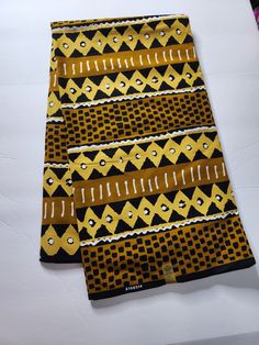 DESCRIPTION African Ankara Fabric. This is high quality African print is 100% cotton and it's 45 inches wide. It is used for making African Clothing, African quilts, & For Home decoration. FYI: Print is Double sided. The listing is for 6yards Each piece of fabric measures: 210-216in by 45in for 6yards If you purchase more than one yard, you will receive one continuous piece. *If you require more than what I have listed, feel free to send me email. CARE INSTRUCTIONS:•DO NOT BLEACH•Hand wash with Traditional Patterned Cotton Fabric For Festivals, Traditional Brown Ankara Fabric, Traditional Patterned And Printed Fabric, Traditional Cotton Batik Fabric, Cotton Fabric With Traditional Pattern Prints, Ankara Fabric With Traditional Patterns, Traditional Ankara Fabric With Pattern Prints, Traditional Ankara Fabric With Batik Print, Traditional Cotton Fabric With Traditional Patterns