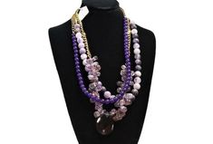 Amethyst and Jade Layered Necklace. A cascade of purple illuminates this three-strand necklace of polished and faceted Amethyst and matte lavender Jade beads. Three different beads and a large pendant give this layered necklace wonderful texture and interest. February birthstone. ●Dimensions: necklace is L:26"  pendant drop is 1.5"●Our shop is currently liquidating a collection of luxury estate sale handbags, vintage statement jewelry, and handmade one-of-a-kind jewelry. We will gladly provide a Purple Handmade Double Strand Necklace, Oval Amethyst Multi-stone Necklaces, Amethyst Oval Multi-stone Necklace, Vintage Statement Jewelry, Luxury Multi-stone Amethyst Necklace, Luxury Amethyst Multi-stone Necklaces, Three Strand Necklace, Gem Necklace, Jade Jewelry