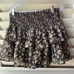 100% Polyester Approx Waist 16” Length 15” 8.32 Adorable Black Flowy Summer Skirt, Casual Black Tiered Skirt Shorts, Summer Black Lined Skirt Bottoms, Black Summer Mini Skort, Black Mini Skirt For Summer, Black Ruffled Summer Bottoms, Summer Black Bottoms With Ruffles, Summer Ruffled Black Bottoms, Skirt Shorts