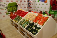 an assortment of vegetables on display in a store