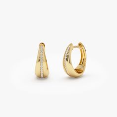 14K Solid Gold Diamond Taper Hoops: Minimalist Huggie Earrings Perfect for Daily Wear - Elegant and Understated Diamond-Adorned Hoops, An Ideal Gift for Her ▶ Details   * Made to Order * Gold KT: 14K Solid Gold (also available in 18K upon request) * Custom Gold Color: Rose Gold, Yellow Gold, White Gold * Inner Diameter: 10 MM * Outer Diameter: 13 MM * Width: Starts at 2.5MM and graduates to 6.50MM towards the Bottom * Drop: 11 MM * Round Diamonds: 34pcs  1.00 MM * Total Diamond Ctw: 0.16 ctw * Diamond Color Clarity: G Color SI Clarity  ▶ See more of our Diamond Earrings here - https://etsy.me/3YbpVq2  ▶ See our storefront here - http://etsy.me/2lUcVnH  ▶ All store sections here * Diamond Rings - http://etsy.me/2lwKUl8  * Diamond Earrings - http://etsy.me/2lyqVBP  * Diamond Necklace - http: Taper Earrings, Hoop Earrings Diamond, Teardrop Diamond, Gold Diamond Hoop Earrings, Gold Armband, Minimalist Gifts, Ruby Jewelry, Diamond Hoop Earrings, Huggie Earrings