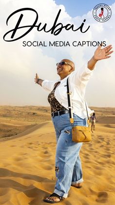 a woman standing in the sand with her arms outstretched