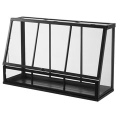 a black and white photo of a planter with three sections on each side that are divided by glass panels