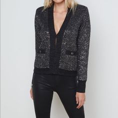 An Effortlessly Glamorous Cardigan In A Sequined Black-And-Charcoal Knit. Semi-Relaxed Design With Deep V-Neckline, Cuffed Sleeves, And Button-Accented Welts. Contrast Trim Lends A Structured Jacket Vibe. Hidden Front Hook-And-Eye Closure. Elegant Fall Sweater For Night Out, Elegant Sweater For Night Out In Fall, Chic Evening Cardigan For Fall, Fitted V-neck Luxury Cardigan, Elegant Black Cardigan For Night Out, Glamorous Evening Cardigan For Winter, Glamorous Evening Winter Cardigan, Luxury Black V-neck Sweater, Chic Fall Cardigan For Party