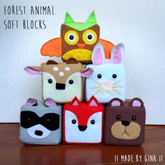 an assortment of animal themed bags on a table with the words forest animal soft blocks