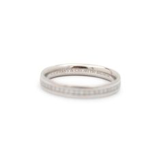 Brand: Tiffany & Co.  Gender: Ladies  Material: 18K White Gold  Size: 6  Shank Width: 0.34 mm  Weight: 2.84 Grams  Ladies 18K white gold diamond wedding band with a half-round shank.  Engraved with "750". The "Tiffany & Co." trademark (or hallmark) can also be found on the item.  Pre-owned in excellent condition. Might show minor signs of wear.  Channel Set in 18 Karat White Gold with:  One (1) round brilliant cut natural diamond:  Carat Weight: 0.340 ct. Color: E - F Clarity: VS1 - VS2 Cut: Ver Minimalist Channel Set Diamond Wedding Ring, Classic Platinum Band With Brilliant Cut, Timeless Brilliant Cut Wedding Bands, Timeless Platinum Bands, Timeless Wedding Bands With Diamond Accents, Classic Platinum Bands With Brilliant Cut, Timeless White Gold Bands With Diamond Accents, Timeless White Gold And Platinum Wedding Ring, Timeless Channel Set Bands For Formal Occasions