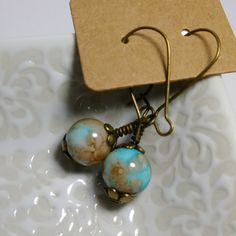 Vintage Glass Bead Earrings (W/A Unique Faux Turquoise Watercolor Look To Them!)On Brass Metal Alloy Findings & Locking French Hooks. Very Boho Feel To These Earrings! *Each Pair Is Unique! All My Handmade Jewelry And Accessory Items Are Treated With Renaissance Wax To Prevent Tarnishing & To Keep Them Looking New. Renaissance Wax Is Used In Museums Around The World. Thanks For Looking! Please Check Out My Closet! Vintage Turquoise Beaded Drop Earrings, Vintage Turquoise Beaded Earrings For Gift, Vintage Turquoise Beaded Earrings Gift, Vintage Turquoise Earrings With Round Beads, Handmade Vintage Turquoise Beaded Earrings, Turquoise Round Bead Earrings For Everyday, Everyday Turquoise Round Bead Earrings, Vintage Blue Beaded Drop Earrings, Vintage Adjustable Beaded Earrings