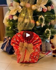 a christmas tree with presents under it