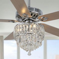 a crystal chandelier hanging from a ceiling fan