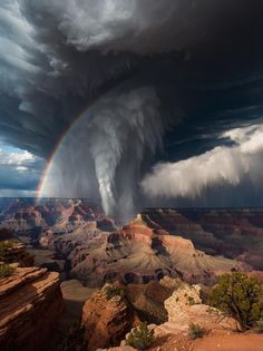 a large storm is coming over the grand canyon