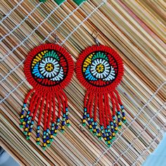 100 % Hand made.Round, light weight, multicolored Zulu earrings. Some earrings may slightly differ from the picture, but still the same primary color. Zulu Earrings, Zulu Women, African Earrings, Earrings Colorful, Round Light, Zulu, Red Bead, Primary Color, Dream Catcher