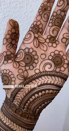 henna tattoo on the palm of a woman's hand