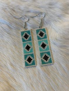 2-inch hand beaded Patterns are property of Blue Roan Bead Co.  DO NOT DUPLICATE Turquoise Beaded Earrings With Black Beads As Gift, Southwestern Blue Beaded Earrings With Round Beads, Handmade Southwestern Blue Beaded Earrings, Turquoise Beaded Beads For Crafting, Blue Beaded Rectangular Jewelry, Blue Rectangular Beaded Jewelry, Southwestern Style Blue Beaded Earrings, Turquoise Beaded Earrings For Gifts, Artisan Beaded Rectangular Jewelry