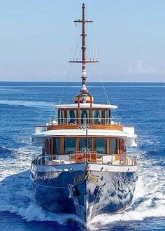 a large white boat in the middle of the ocean