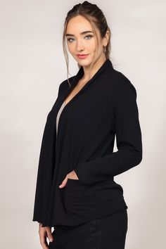 This is a final sale item and cannot be returned for a refund. Long sleeve jersey knit. Open front cardigan. Mock shawl collar. Garment-dyed. This super soft, lightweight cardigan has a drapey open front design with pockets and raw hem details. Form-fitting with a comfortable stretch. Perfect transitional loungewear. Spring Shawl Collar Cardigan For Layering, Versatile Black Open Front Cardigan, Black Wrap Cardigan For Layering, Versatile V-neck Stretch Outerwear, Versatile Stretch V-neck Outerwear, Long Sleeve Jersey, Lightweight Cardigan, Open Front Cardigan, Front Design