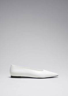 These timeless elegant ballerina flats are crafted from supple leather in Portugal. They feature sharply pointed toes and rest on slight heels. White Pointed Toe Ballet Flats With Leather Sole, Elegant Pointed Toe Ballet Flats For Work, Elegant White Slip-on Pointed Toe Flats, Chic Ballet Flats For Business With Flat Heel, Sleek Formal Slip-on Ballet Flats, Elegant White Pointed Toe Flats For Work, Chic White Pointed Toe Flats For Work, Classic Slip-on Pointed Toe Flats With Low Heel, Sleek Slip-on Ballet Flats For Spring