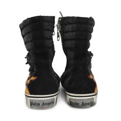 Palm Angels high-top sneakers in black suede with black distressed canvas. Features orange and red leather flame on the sides, white laces with black logo monogram, and zipper closure in silver hardware on the inner sides. The white rubber sole features purposeful distressing and wear. Brand = Palm Angels Condition = 8/10, Very good Size = Women's 39 EU Material = Canvas/Suede/Rubber Hardware = Silver SKU = 11329-18 Black High-top Sneakers With Logo Patch, Urban High-top Boots With Vulcanized Sole, Low-top Sneakers With Zipper For Streetwear, Low-top Sneakers With Zipper Closure For Streetwear, Mid-top Studded Boots For Streetwear, Urban Boots With Vulcanized Sole For Streetwear, Urban Style Boots With Vulcanized Sole For Streetwear, High-top Boots With Vulcanized Sole For Streetwear, Edgy High-top Sneakers With Vulcanized Sole For Streetwear