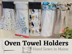 towels hanging on a clothes line with the words oven towel holders hand sewn in maine