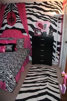 a zebra print bedroom with pink and black decor