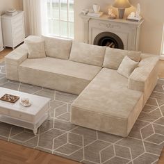 a living room with a large sectional couch and coffee table in front of a fireplace