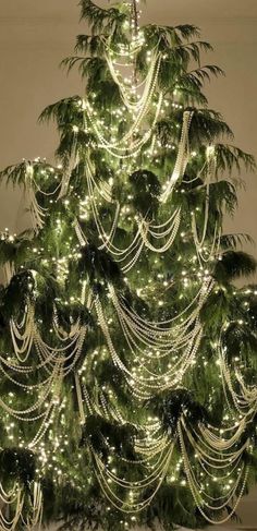 a christmas tree is decorated with lights and garlands