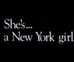 the words she's a new york girl are lit up in black and white