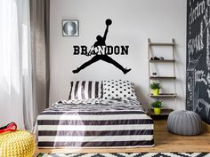 a bedroom with a basketball wall decal on the wall