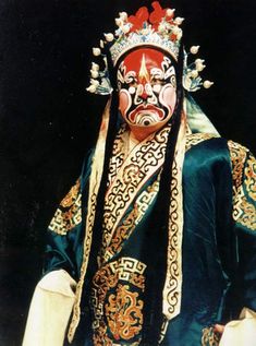 An actor in the Peking Opera. The Peking Opera is a form of traditional Chinese theater which combines music, vocal performance, mime, dance, and acrobatics. It arose in the late 18th century and became fully developed and recognized by the mid-19th century. Theatre Masks