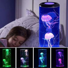 the jellyfish lamp is lit up in different colors and sizes, while it's also turned on