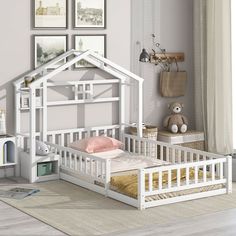 a child's bedroom with a white bed frame