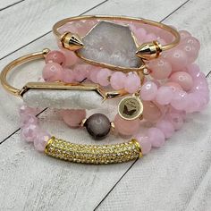 Meet our 'Pink Princess' bracelet stack – where glam meets a dash of royal sass for a coronation of fabulous flair! These bracelets aren't just accessories; they're your tiara in the world of wristwear, ready to make every day a regal runway. A Real Stunner - Reach for this beautiful stack when you want to stand out from the crowd. Wear them all on one wrist and stack 'em up or wear 3 on one wrist and 3 on the other your favorite watch! Lead & Nickel Free Bracelets are 'one size fits most' and are designed to fit wrists up to 7.5" comfortably Set of 6 Bracelets (4 Stretch, 1 Gold Arrow Cuff & 1 Gold Cuff with a White Druzy Stone Inlay) Pave Crystals Quartz Natural stone Pink Hues with little tiny hints of gray in some bead Please be aware that due to the unique and handmade nature of each Glamorous Adjustable Bracelet As Gift, Glamorous Adjustable Bangle Bracelets, Adjustable Pink Gold Bracelet For Party, Pink Stackable Beaded Bracelets For Party, Elegant Pink Bangle Stretch Bracelet, Elegant Pink Stackable Bracelets, Pink Jubilee Bracelet For Party, Elegant Pink Stackable Stretch Bracelet, Trendy Pink Jubilee Bracelets