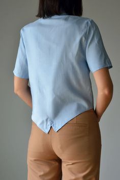 Vintage Marco Pecci Couture Asymetrical Shirt in Light Blue | Etsy Asymmetrical Summer Blouse With Buttons, Summer Tops With Buttons And Asymmetrical Hem, Asymmetrical Summer Workwear Shirt, Summer Workwear Tops With Curved Hem, Light Blue Short Sleeve Button Blouse, Light Blue Short Sleeve Blouse With Buttons, Fitted Asymmetrical Blouse For Daywear, Blue Short Sleeve Blouse For Daywear, Summer Workwear Shirt With Asymmetrical Hem