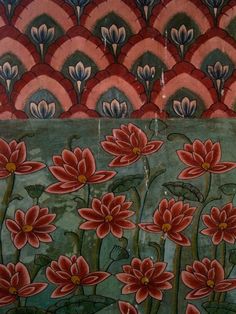 an ornate painting with red flowers and green leaves