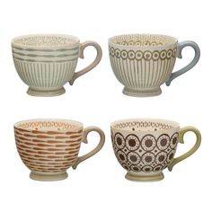 four coffee cups with different designs on them